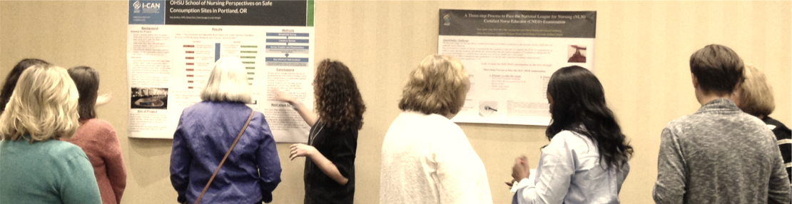 OCNE Faculty viewing posters at a poster session